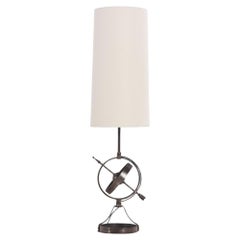 A French polished steel tall table lamp C 1950.