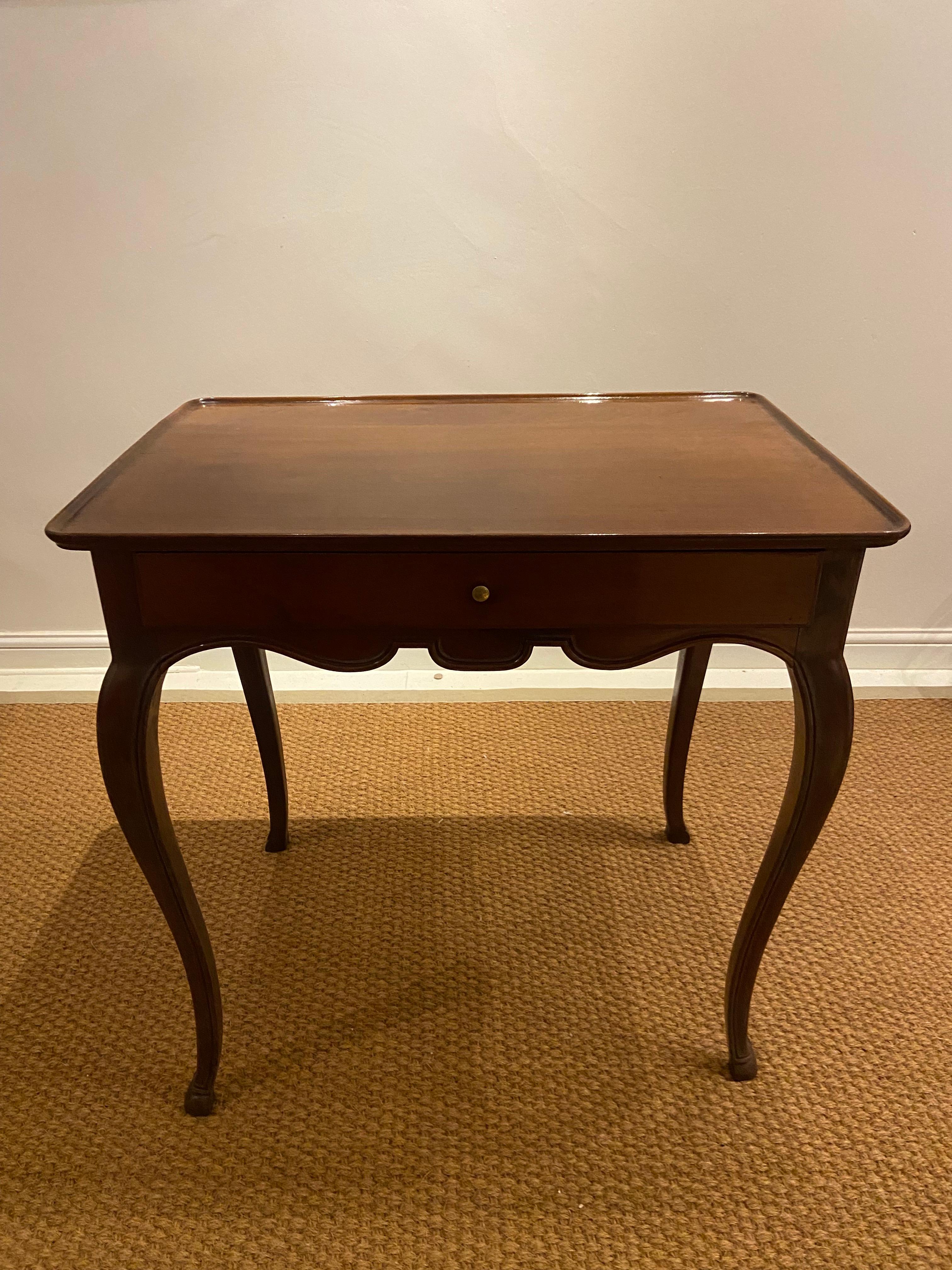A French Provincial mahogany table (mid-18th century). With hoof feet.