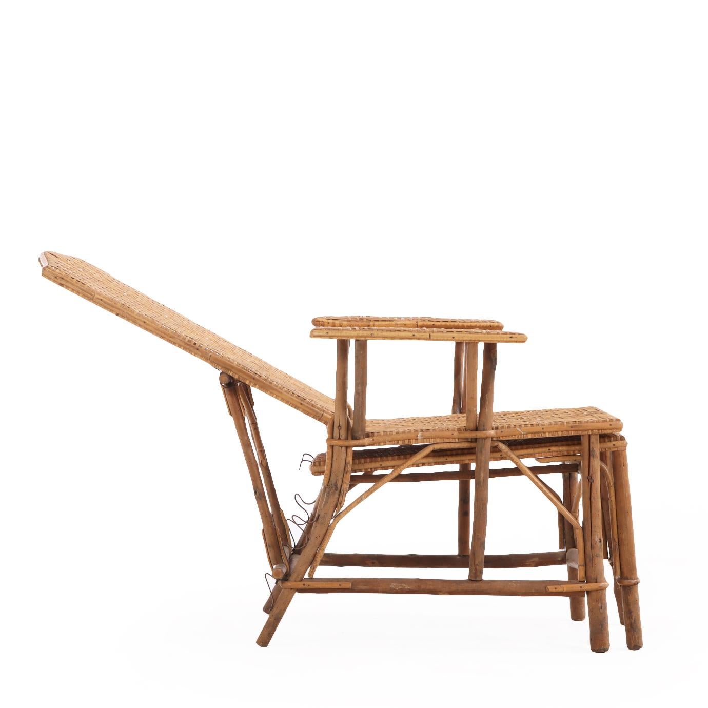 This delightful and versatile armchair has a shaped crest over a straight adjustable back, and a retractable foot stool / ottoman. This form is also referred to as a steamer chair from its use on board ships.