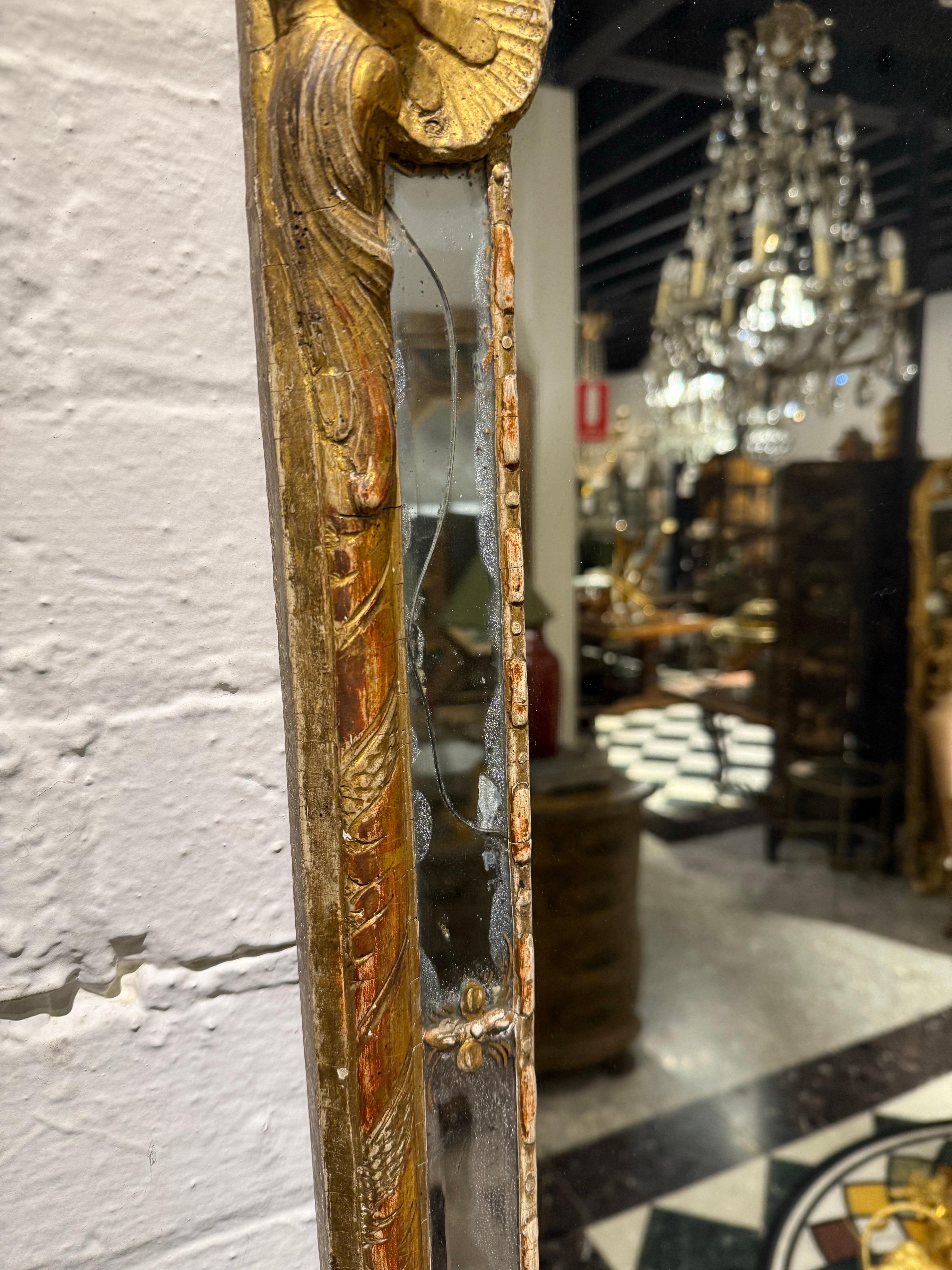 Intagliato a mano A French Régence Gilt Hall Mirror, 18th Century in vendita