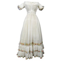 A French Regency Dress in cotton muslin embroidered with wool Circa 1825