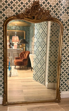 A French Rococo Giltwood Mirror with Bevelled Edge, Louis XV Period