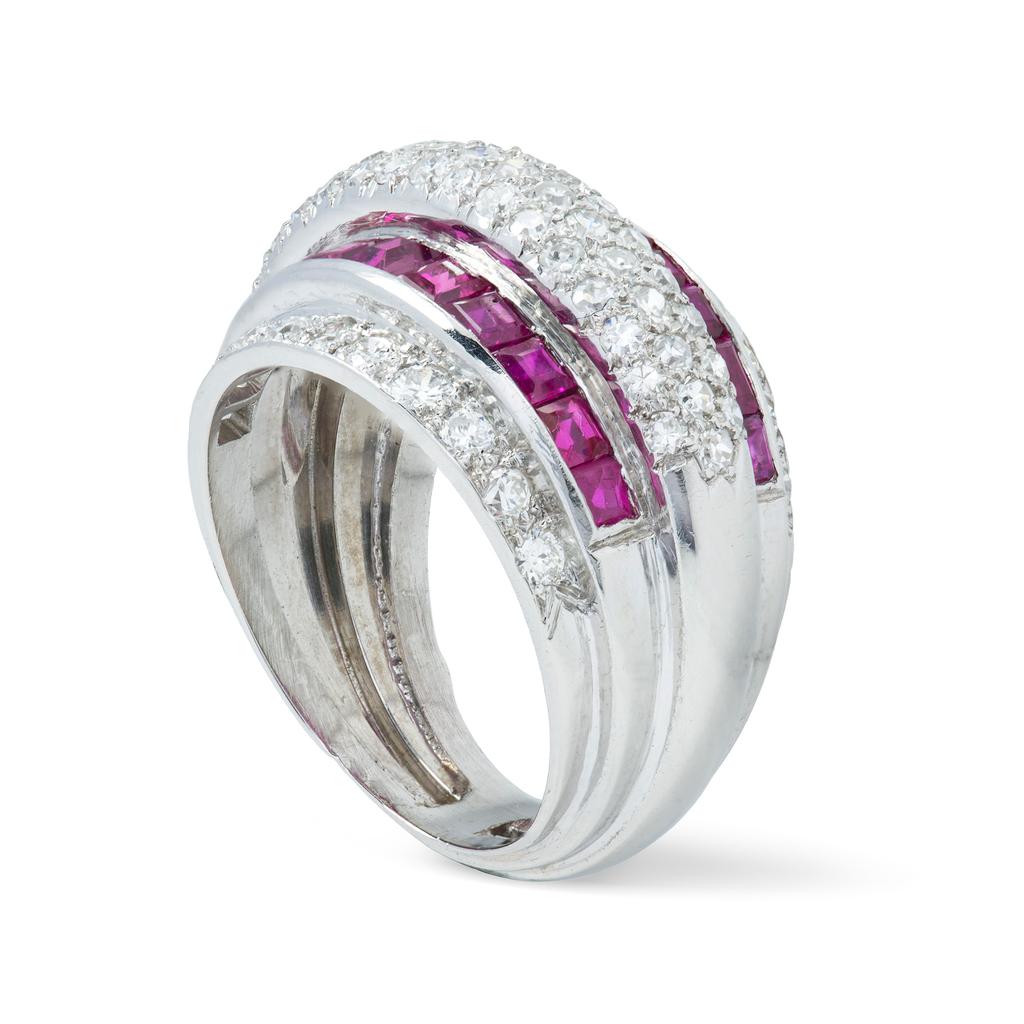 A French ruby and diamond bombe ring, the central row pave-set with eight-cut diamonds, set between two rows of calibre-cut rubies, within two rows of brilliant-cut diamonds, diamonds weighing approximately a total of 1.2 carats, the calibre-cut