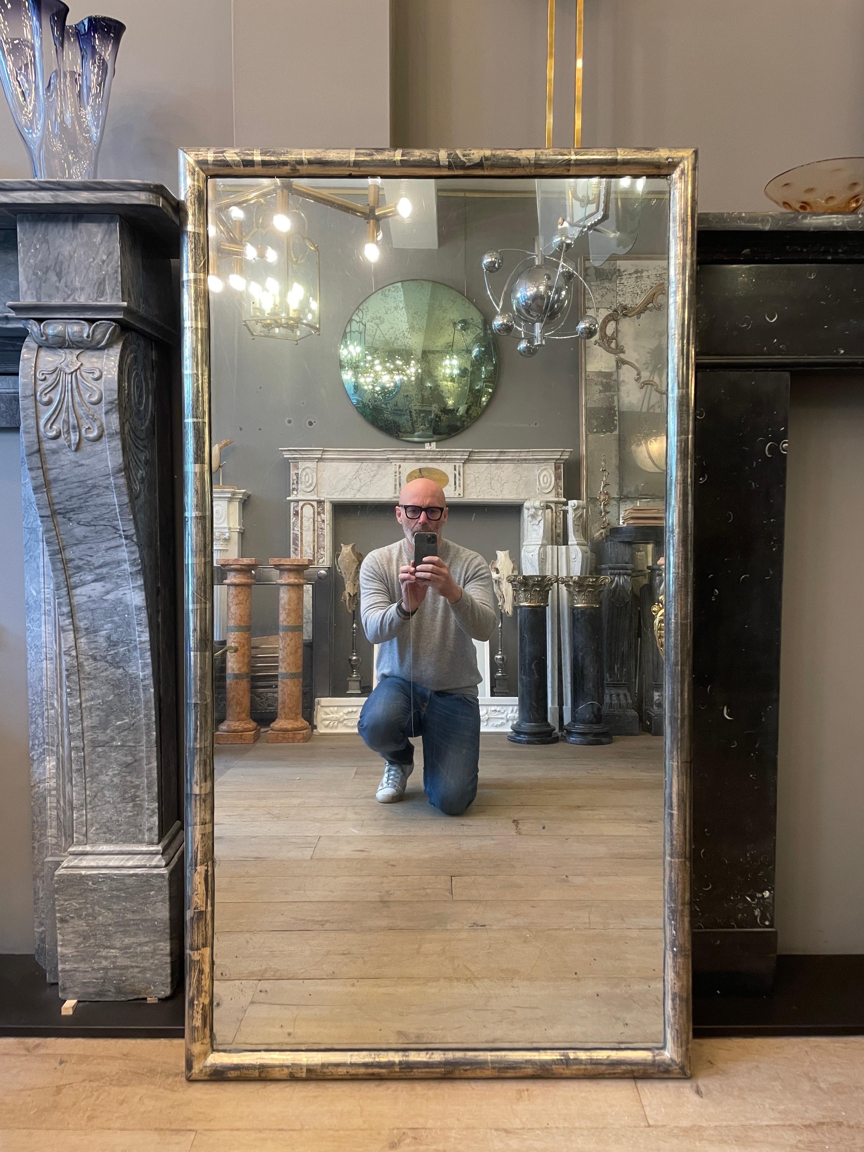 A silver gilt in the faux bamboo taste bistro mirror with original glass plate. Some distressing and foxing which has been imaged in the slider.

Turn of the century.