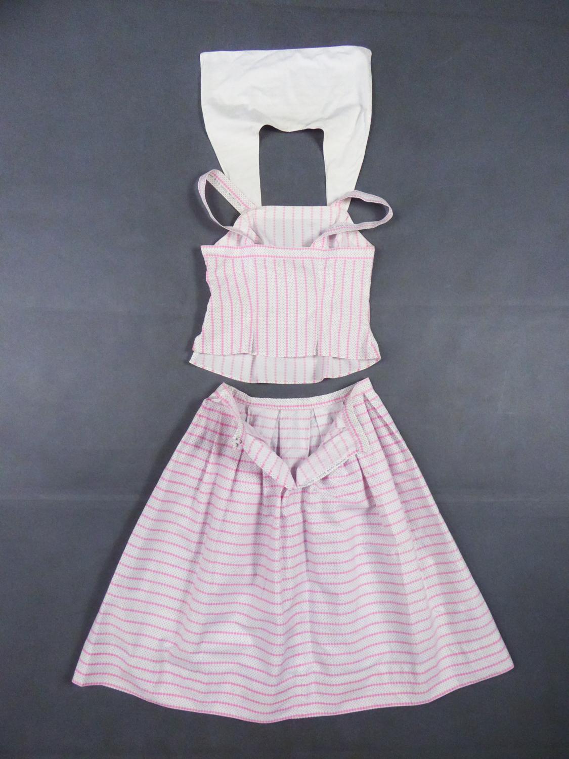 Circa 1960/1965
France

Summer skirt and top set in printed cotton by Jean Dessès dating from the early 1960s. In the spirit of Brigitte Bardot's gingham dresses, printed cotton with pink star stripes and small black polka dots on a white