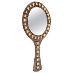 Miroir à main en forme de guirlande avec incrustation de verre par Line Vautrin