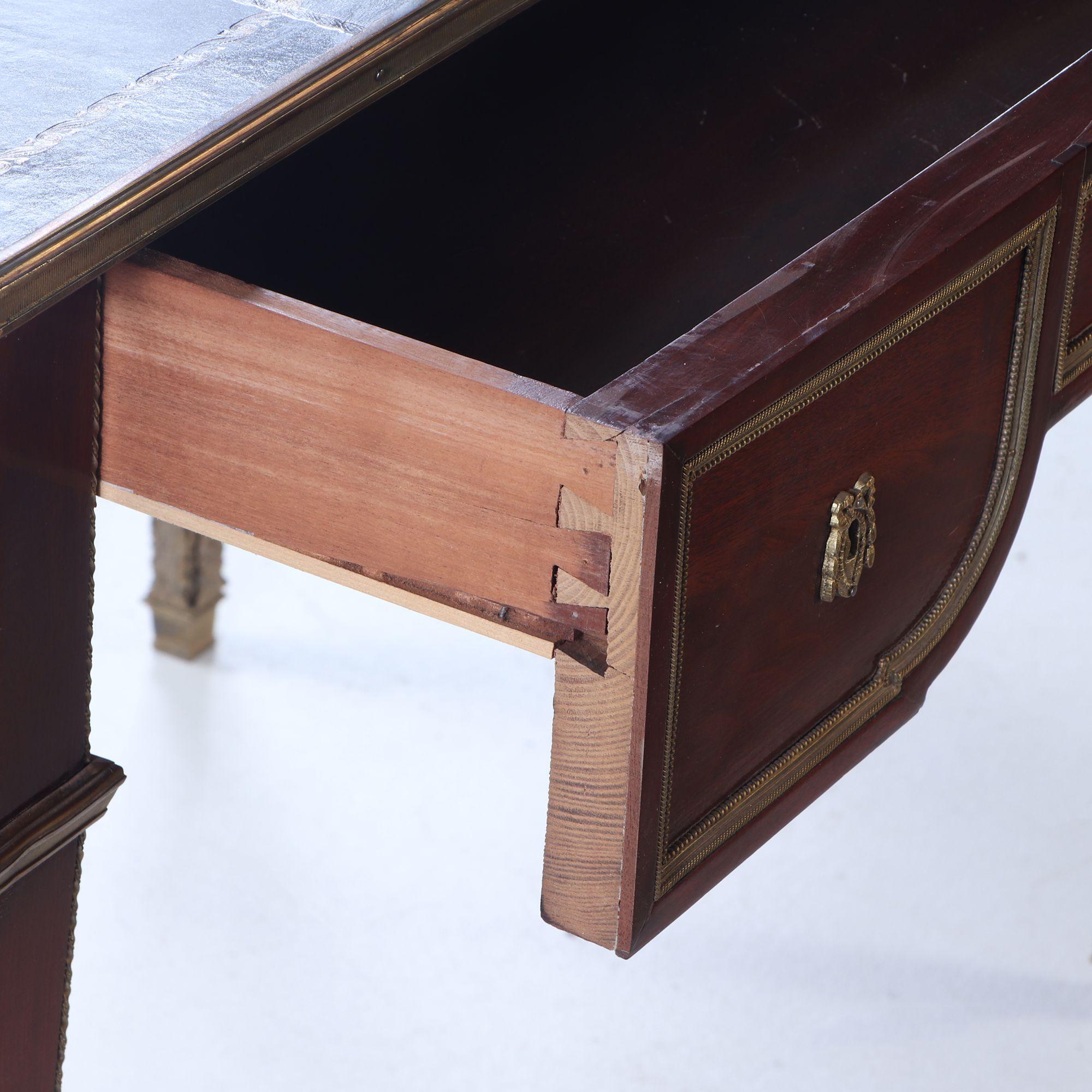 Mid-20th Century A French Louis XVI style three drawer mahogany bureau plat desk C 1930 For Sale