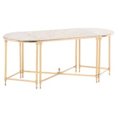 A French three-part brass coffee table, in the manner of Maison Jansen, C 1970.