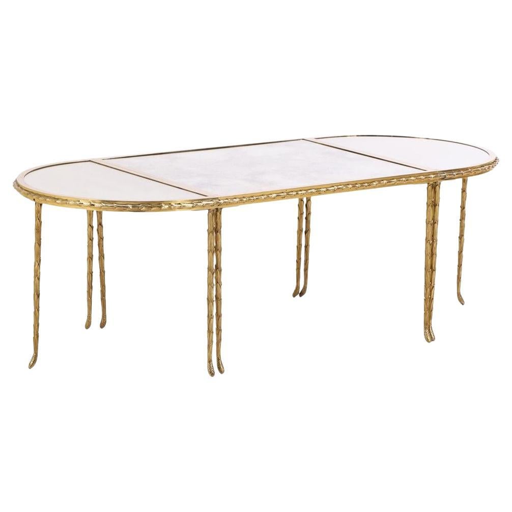 A French three-part gilt bronze coffee table, attributed to Bagues, C. 1960. For Sale