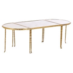 A French three-part gilt bronze coffee table, attributed to Bagues, C. 1960.