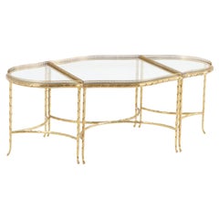 A French three-Part Gilt bronze, Glass Coffee Table attributed to Bagues C 1965