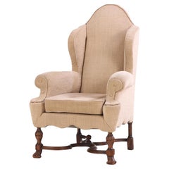 A French Tudor Style Walnut Wing Chair, C. 1900.