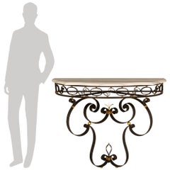 A French turn of the century Wrought Iron, Gilt Metal and marble console