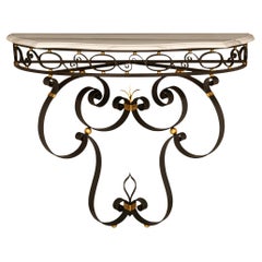 A French turn of the century Wrought Iron, Gilt Metal and marble console