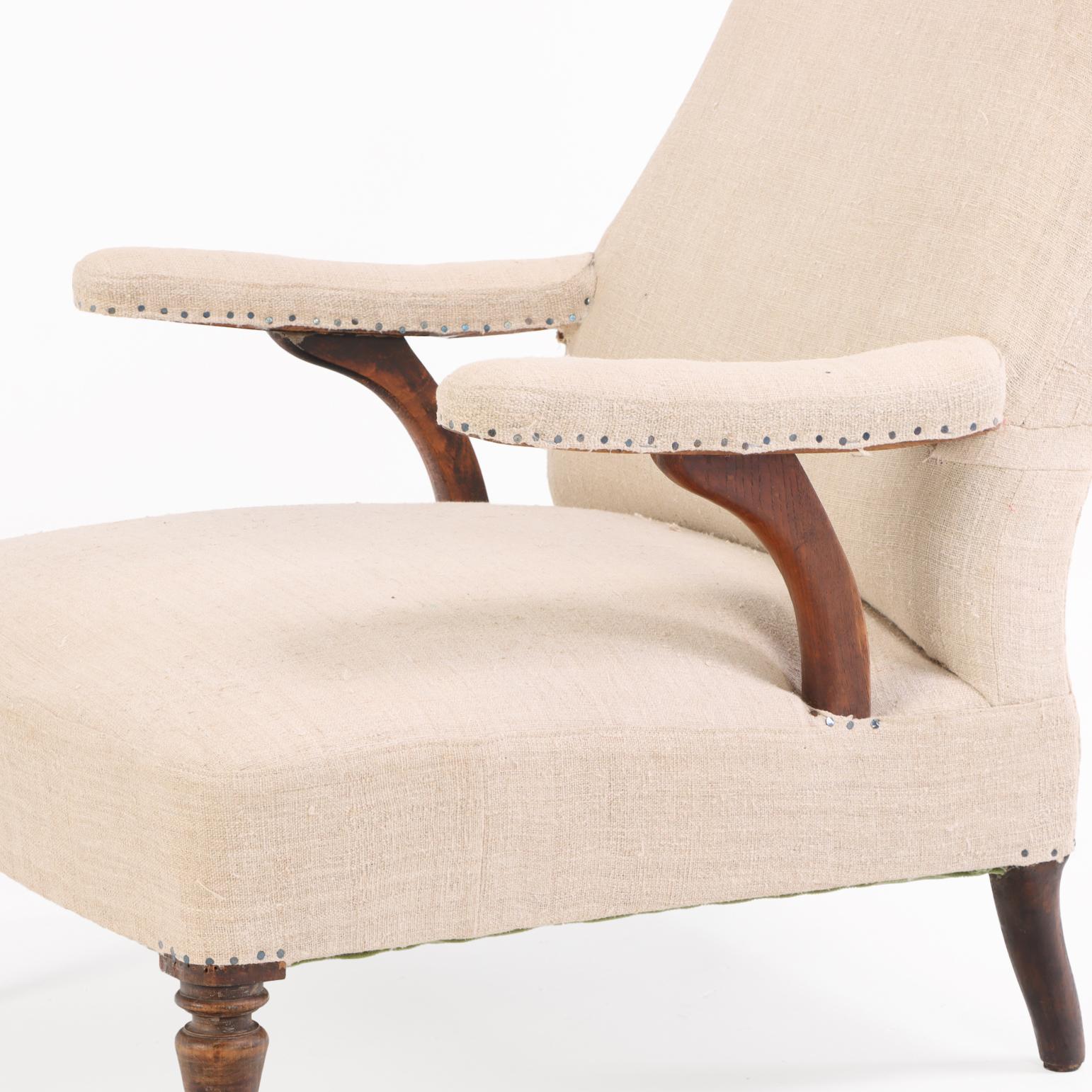 19th Century A French Walnut Floating-Arm Library Chair, C. 1860. For Sale