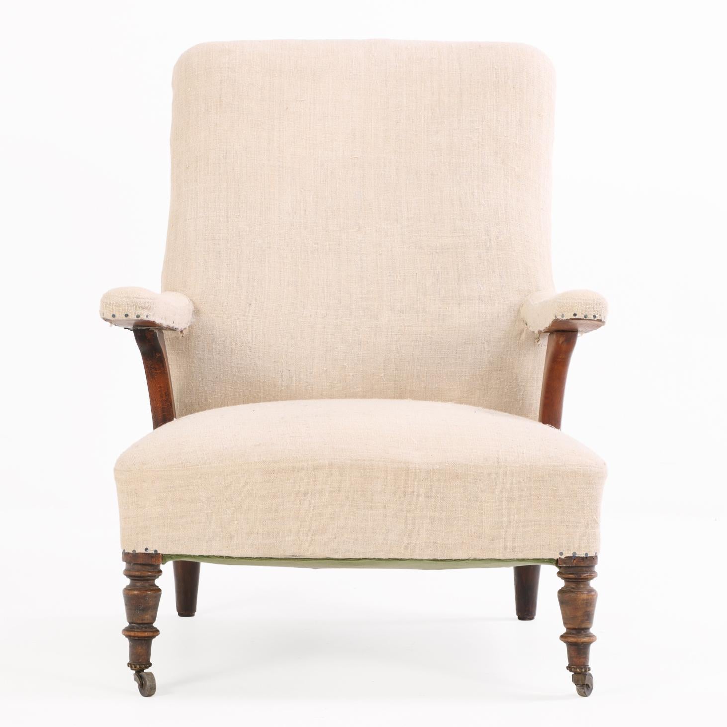 Upholstery A French Walnut Floating-Arm Library Chair, C. 1860. For Sale