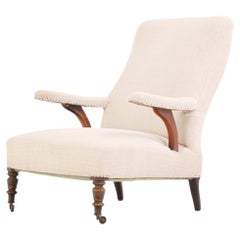 A French Walnut Floating-Arm Library Chair, C. 1860.