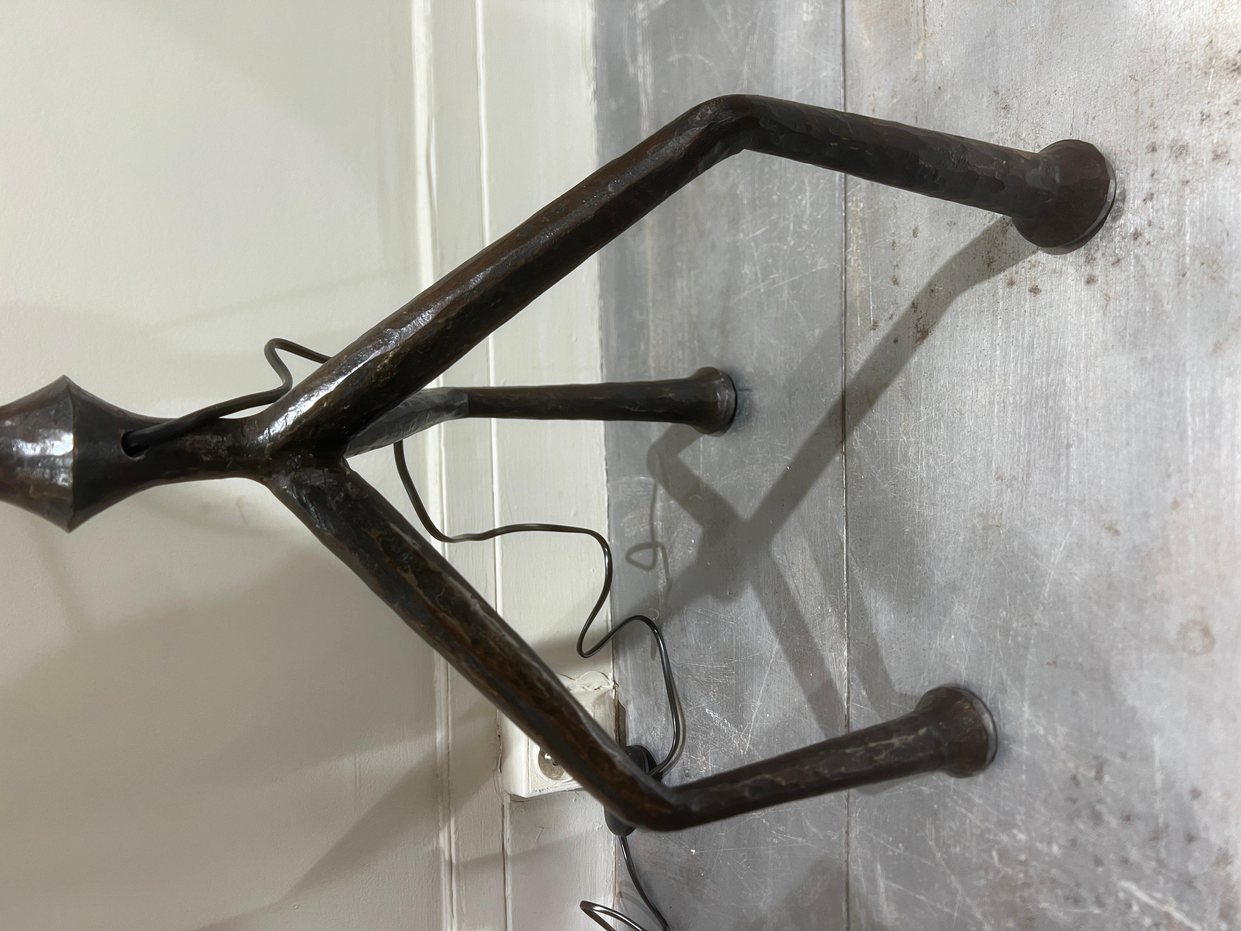 A very elegant wrought iron floor lamp France circa 1950 
Size of the iron is H 125 cm.