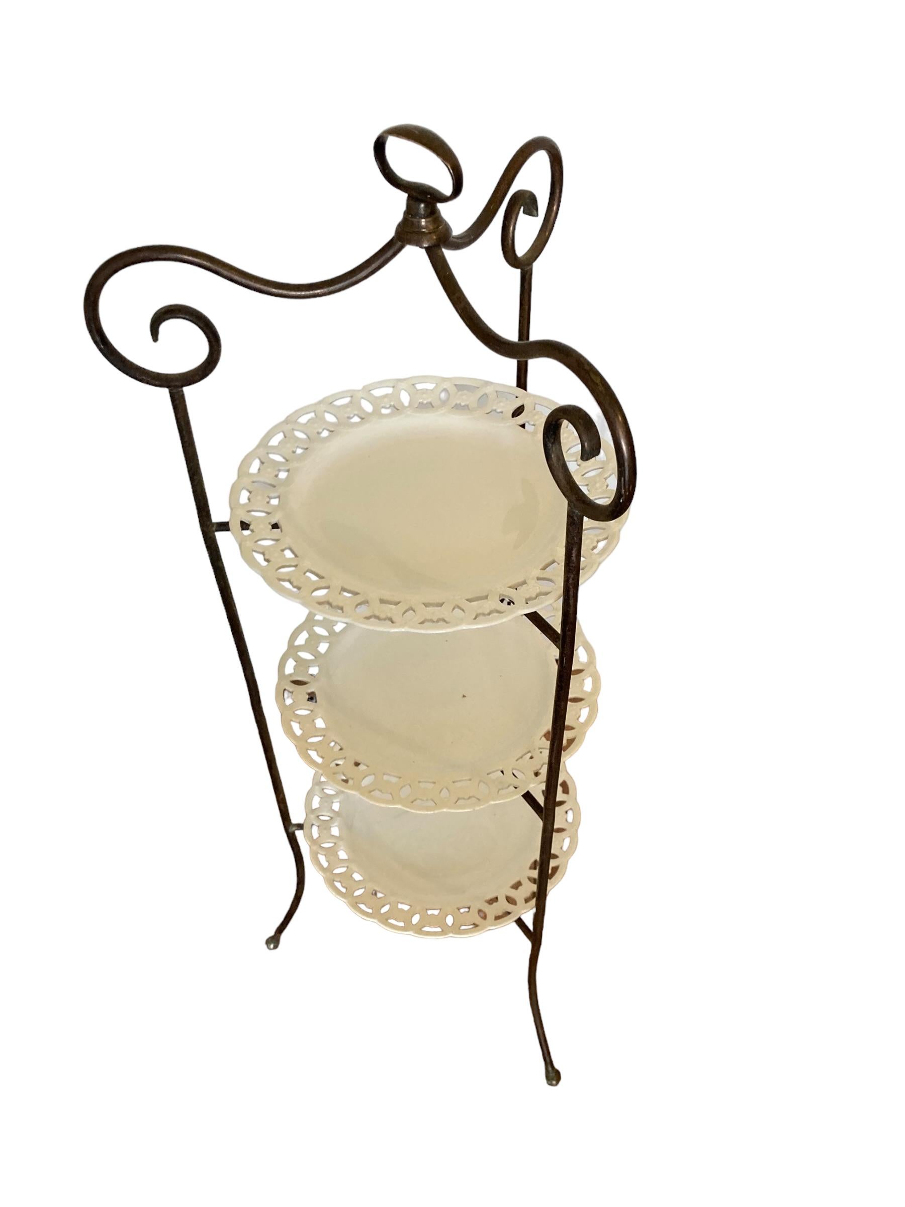 Art Deco A French Wrought Iron three tier cake stand with ornate porcelain plates For Sale