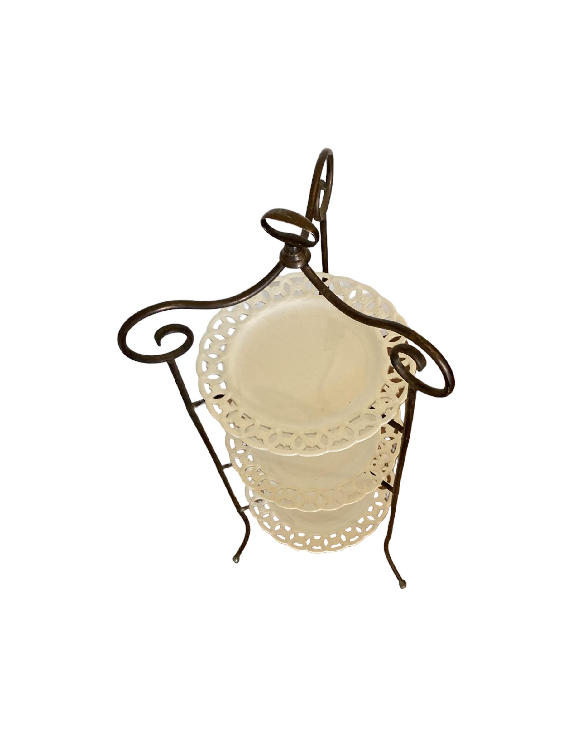 Porcelain A French Wrought Iron three tier cake stand with ornate porcelain plates For Sale