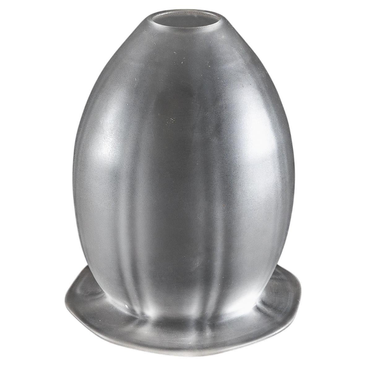 A Frosted Glass Shade with Subtle Vertical Ribbing & Flared Base