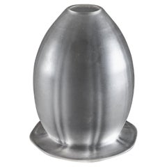 A Frosted Glass Shade with Subtle Vertical Ribbing & Flared Base
