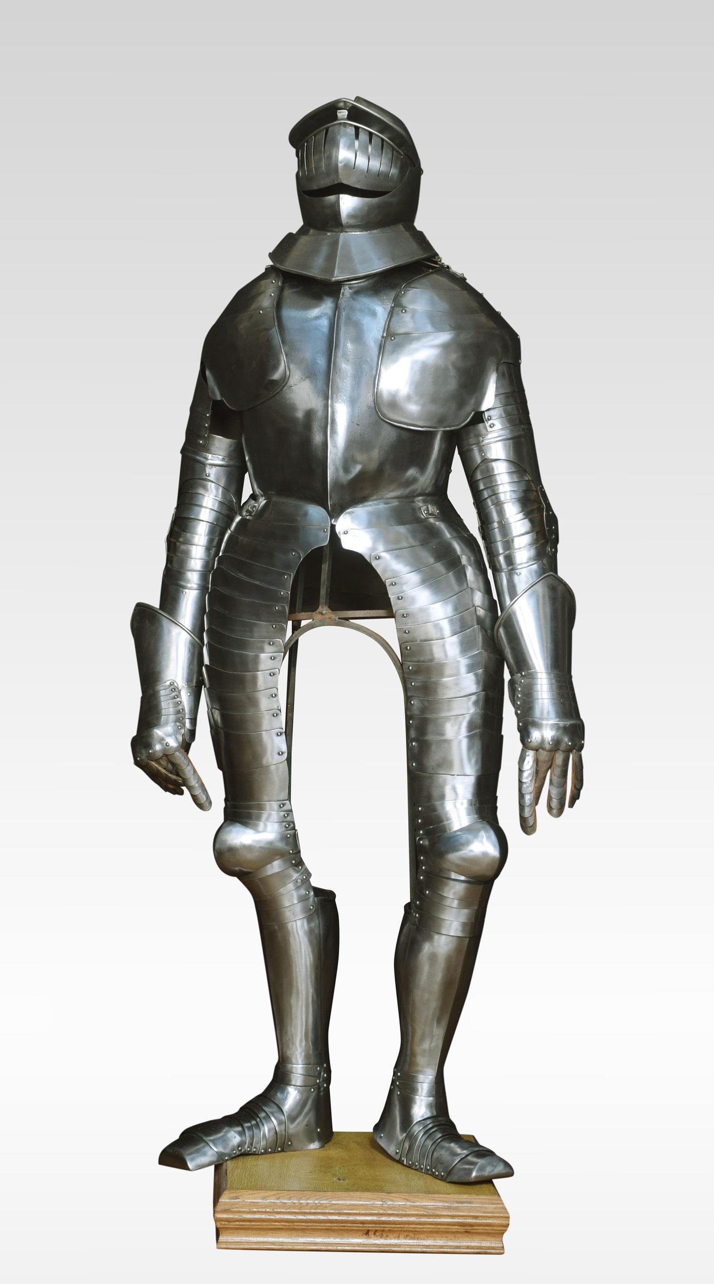 Cuirassier armour in the 17th century style. The helmet with a mild comb, open eyelets, large brow peak and two-piece visor, breastplate with raised medial ridge, shoulder and arm armour comprising multiple hinged plates, winged elbow cop, gauntlets