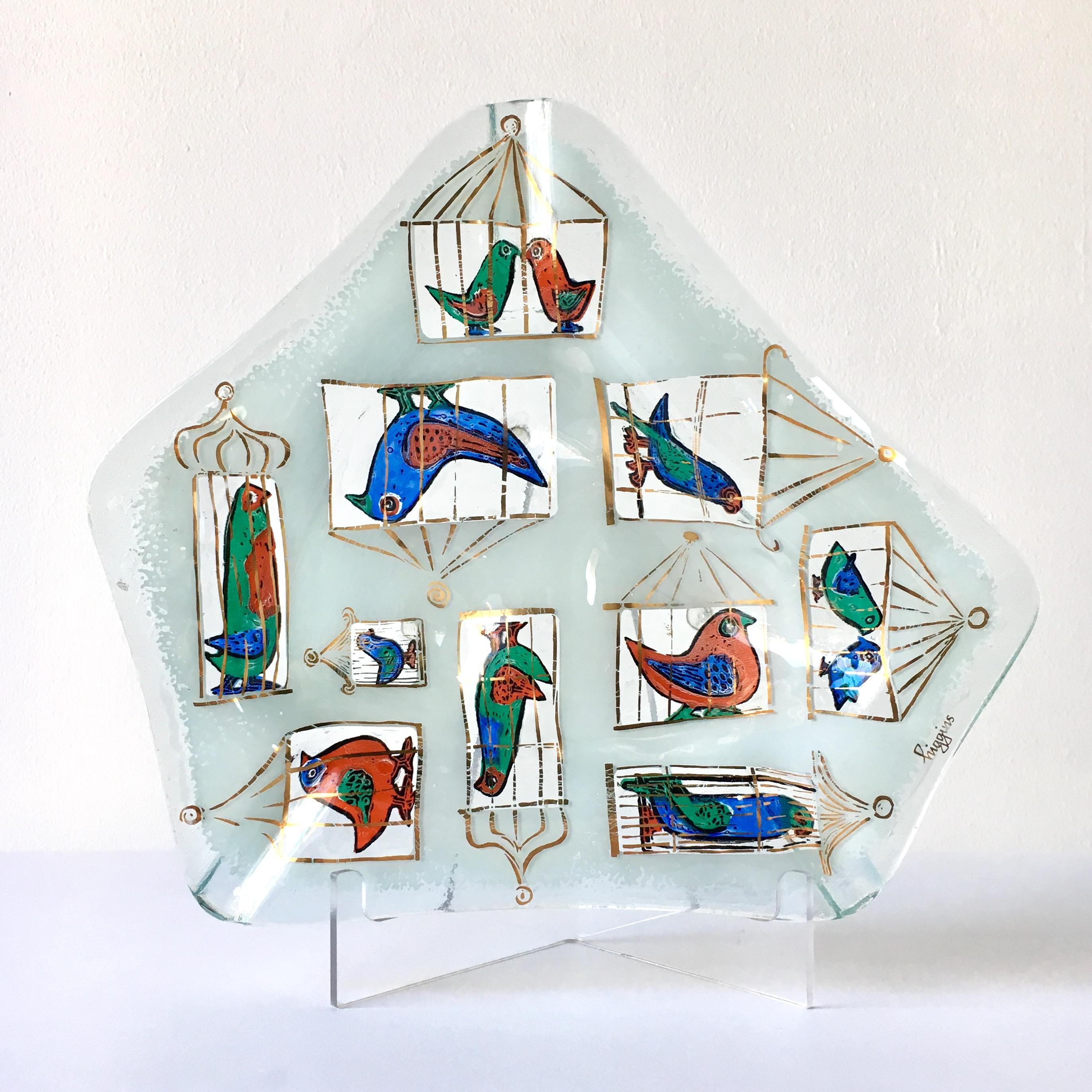 A freeform fused glass ashtray illustrating birdcages by Michael and Frances Higgins, USA, 1957-1965.

Michael Higgins (1908-1999) and Frances Higgins (1912-2004) met in Chicago and were married in 1948. They had a fascination of modern glass