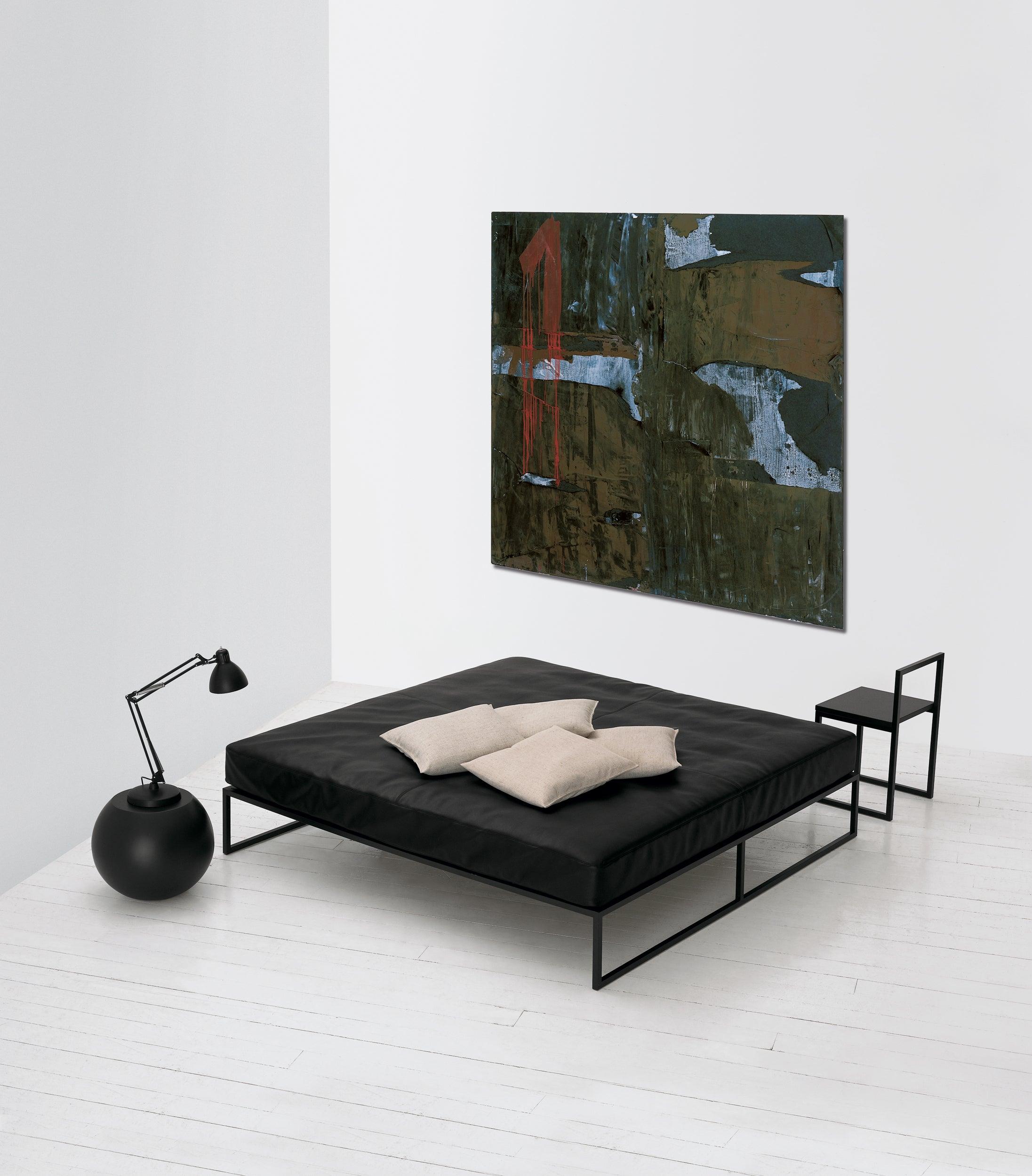 The perfect emblem of A.G. Fronzoniâ€™s works, the Fronzoni â€™64 bed is a conceptual furnishing piece; a sober and essential encounter of straight lines with spatial planes, where geometry reigns supreme. This bed is made entirely of squared