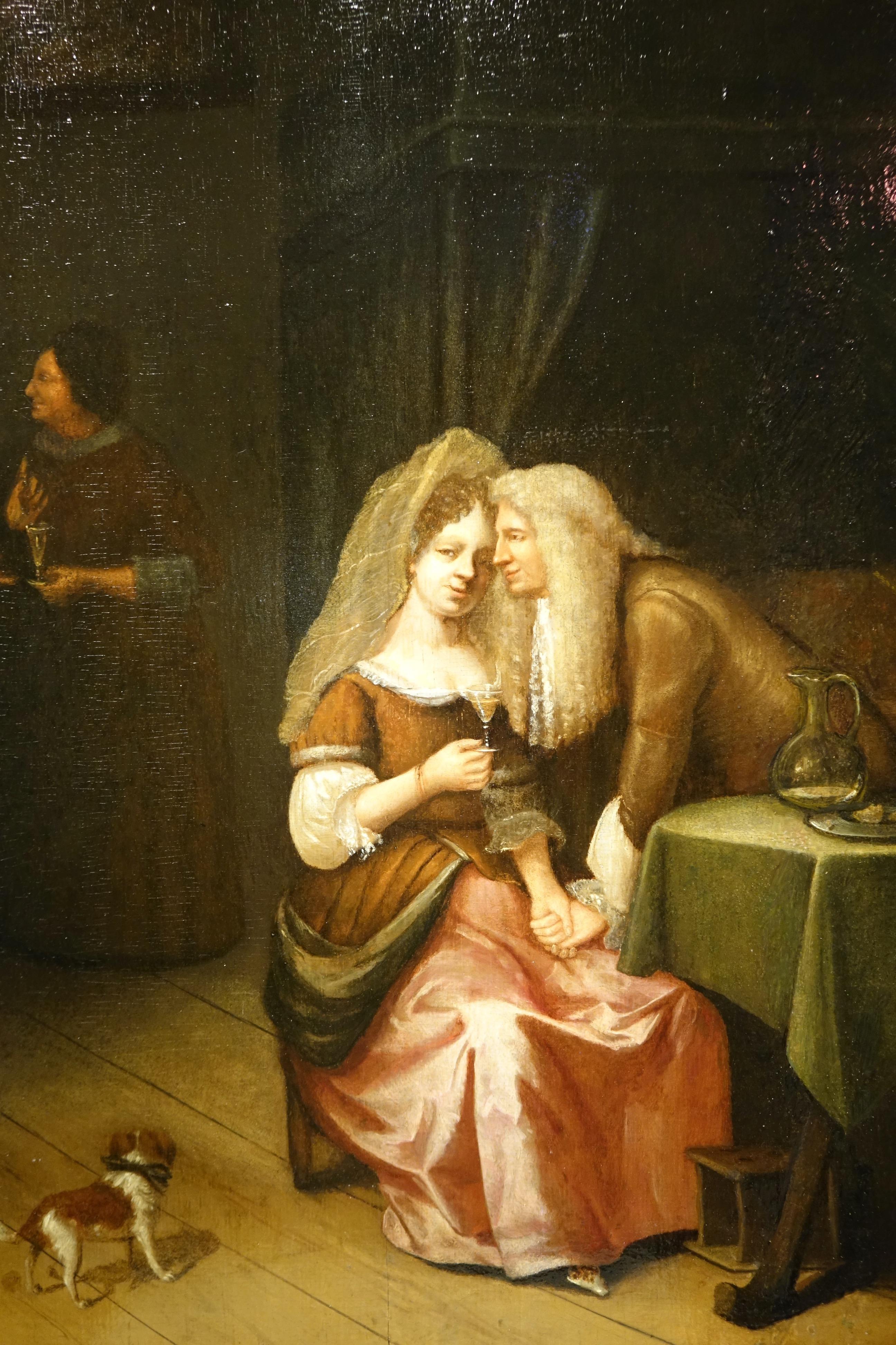 A gallant scene portraying a man courting a seated young woman holding a glass in her hand. 
A young dog in the foreground is watching two characters in the background, one of whom is a woman carrying a similar glass that she is undoubtedly about to