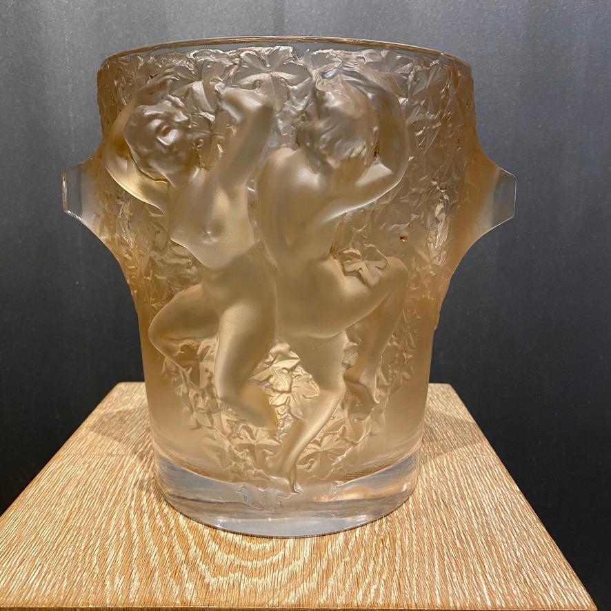 The Ganymede champagne cooler was designed by Marc Lalique for Maison lalique circa 1947 when he became the manager of the company after R.Lalique's death in 1945.

The cooler introduces both the use of cristal as the both of a Marc Lalique's style