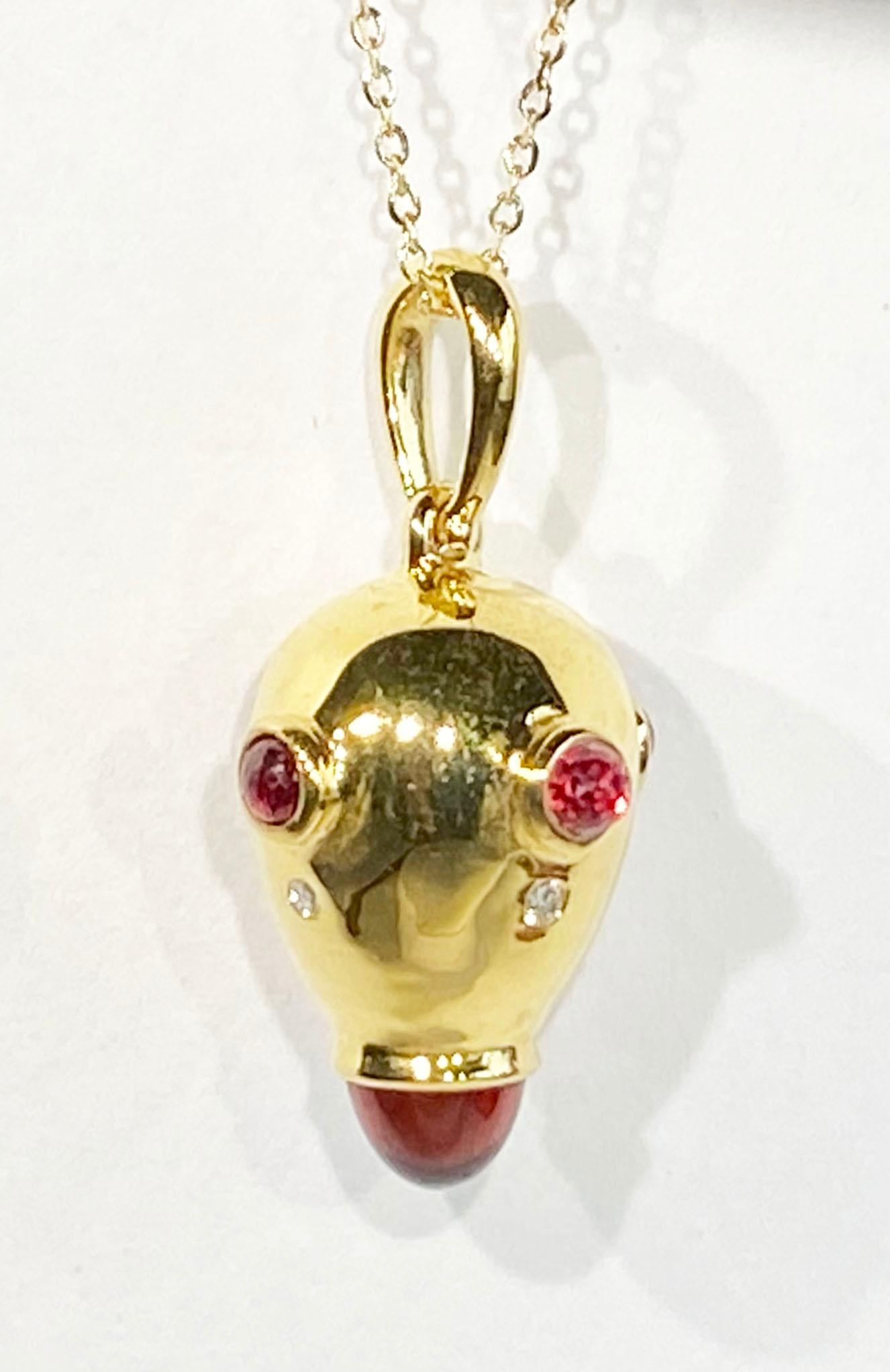 A Gold Plated Silver Drop pendant, Set with Pyrope Garnet Cabochons,  Red Sapphire Half Briolettes and Diamonds. The Pendant hangs from an 18kt Gold Chain of 18
