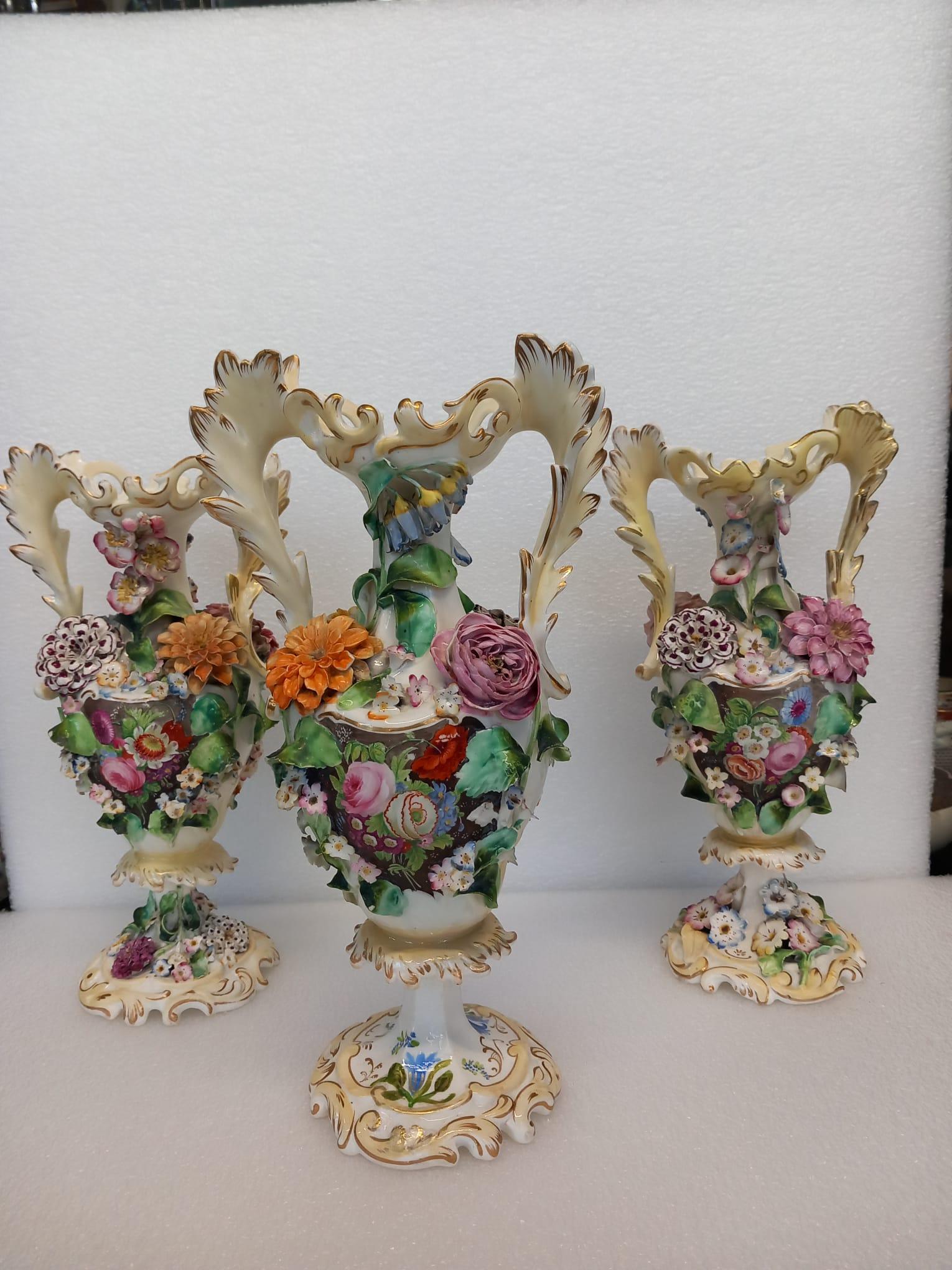 19th Century A garniture of three antique English porcelain vases, heavily decorated  For Sale