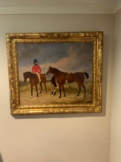 a gentleman with horse and groome