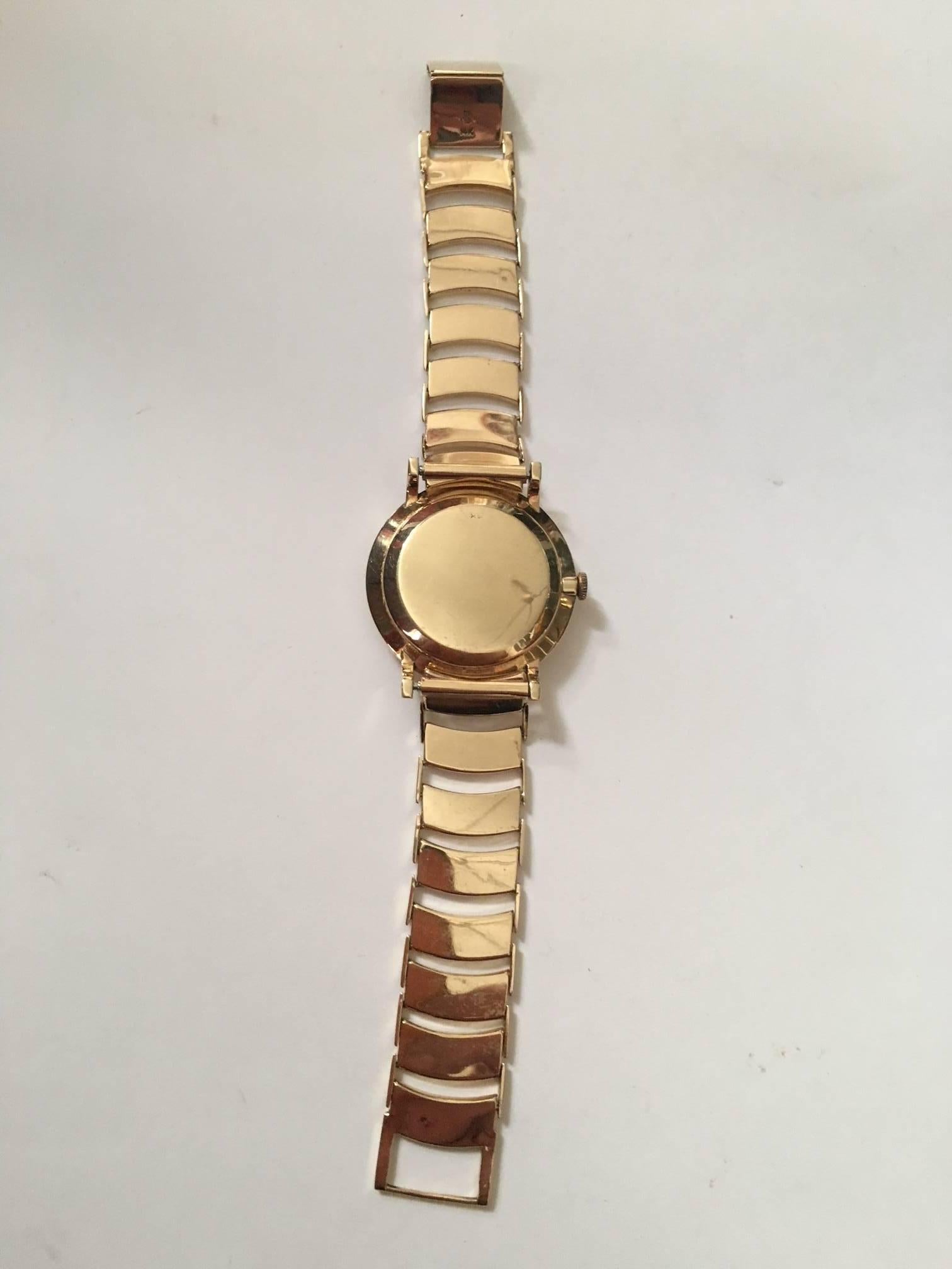 Modernist A gentleman's 1950's Movado, 14 karat yellow Gold automatic bracelet wristwatch  For Sale