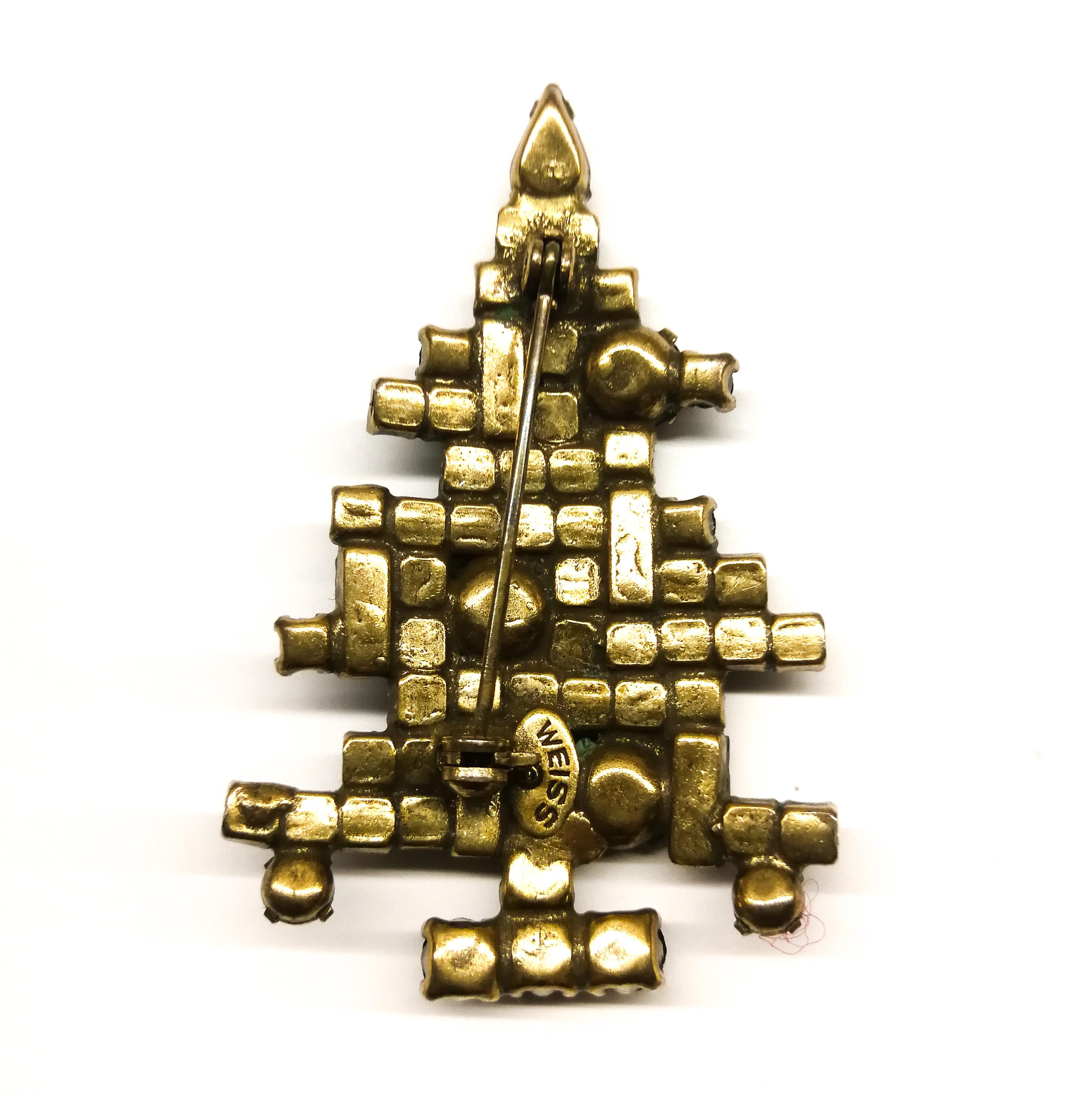 A stylised and imaginative take on a Christmas Tree, this brooch is an iconic design, made by Weiss, and well known in vintage costume jewellery, for its unusual geometric, Art Deco style, although made in the 1950s. This design is the 'middle'
