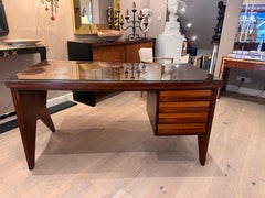 A geometric design four drawers writing desk attributed to Silvio Cavatorta