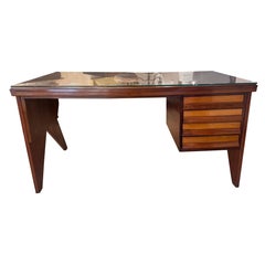 A geometric design four drawers writing desk attributed to Silvio Cavatorta