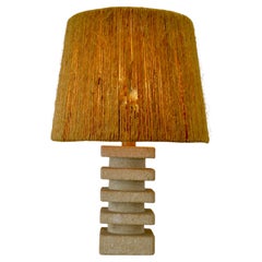 A geometric limestone lamp with raffia lampshade - France - 1970s