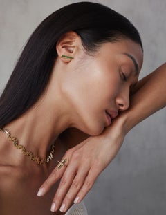 A Geometric ring with 0.5 Carat Emerald Baguette set in 18k Solid Yellow Gold