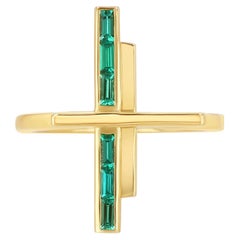 A Geometric ring with 0.5 Carat Emerald Baguette set in 18k Solid Yellow Gold