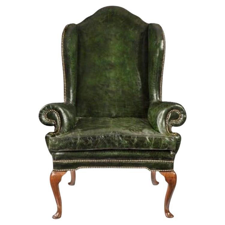 A George I walnut wing armchair of generous proportions For Sale