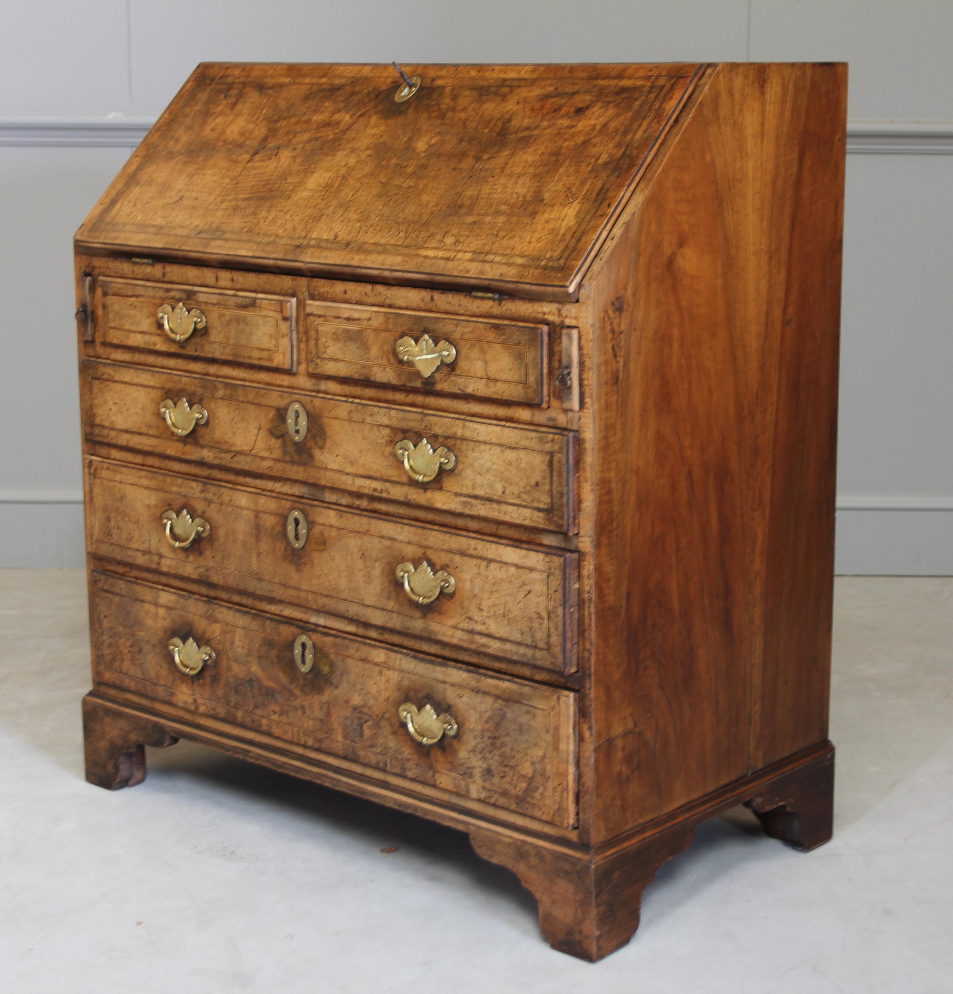A George III burr walnut bureau with boxwood and ebony inlay, The sloping full enclosed pigeonholes and drawers over two short and three graduated drawers on bracket feet. with a working lock and key for safe storage.
Coming from the period of King
