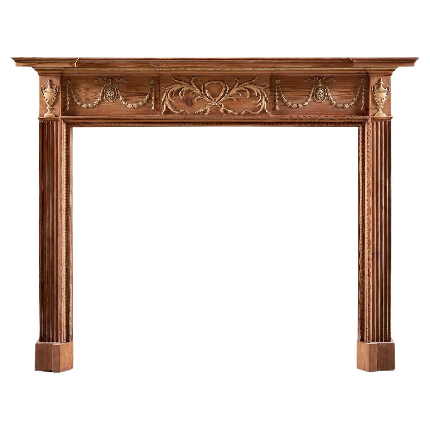 Cheminée George II en pin et tilleul sculpté