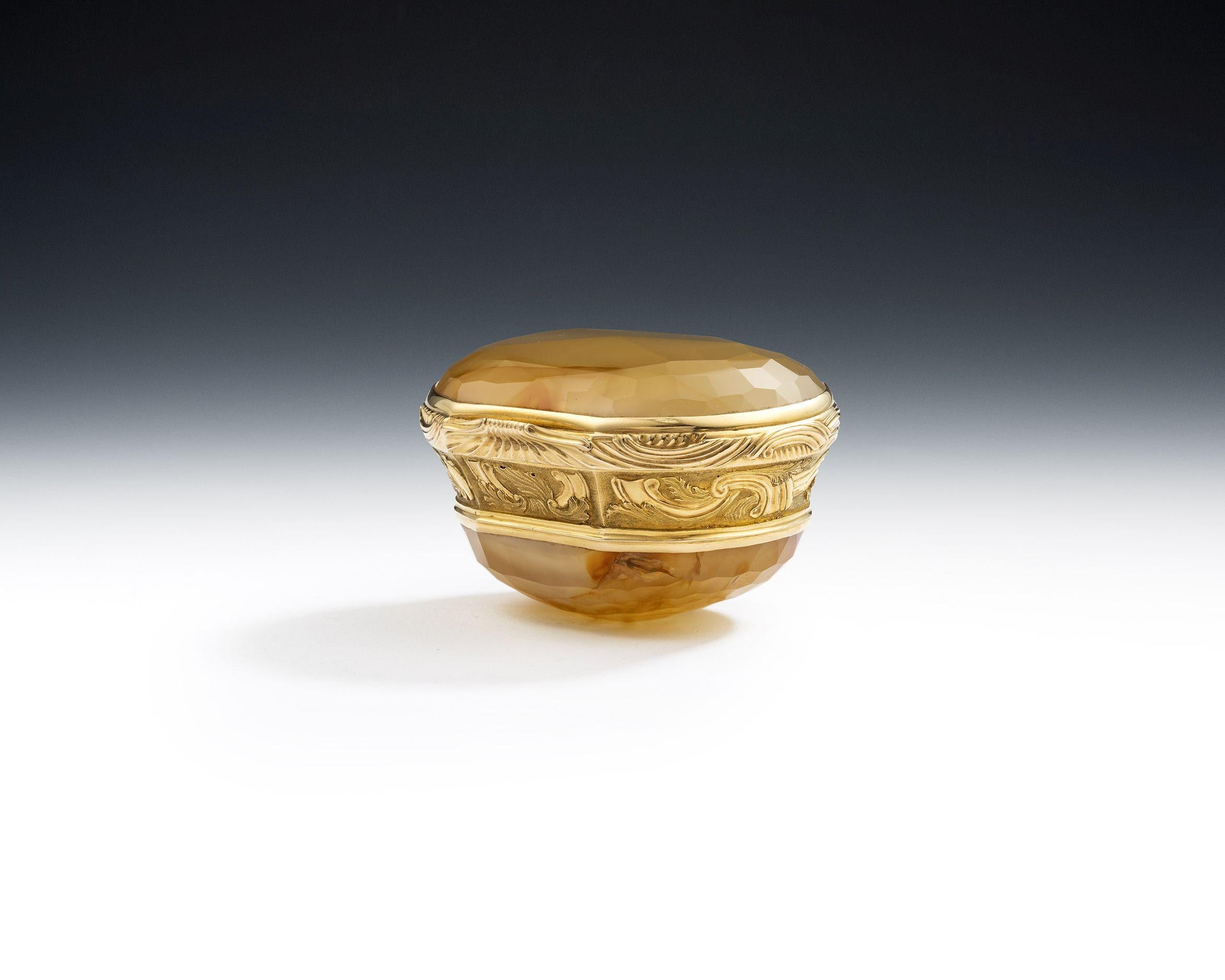 An Important George II Gold Mounted Hardstone Snuff Box. English Circa 1740/50.

The Snuff Box is one of the most important we have offered over the years and has a tall form. It is inset, on the cover and base, with beautifully shaded and
