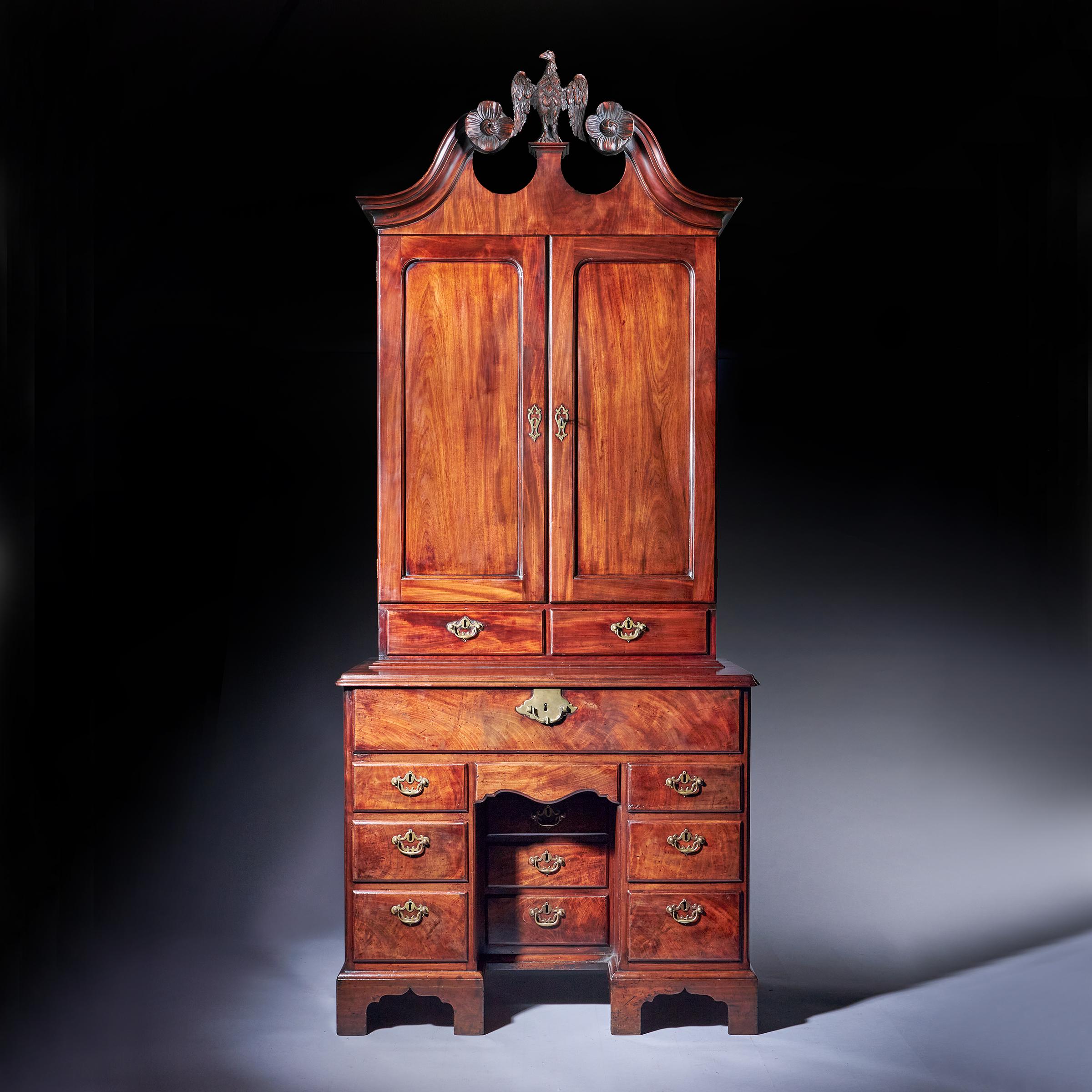 An original and rare two-part George II 18th century Irish architects figured mahogany secretaire bookcase, circa 1740, Ireland. 

Attributed to Christopher Hearn of Dublin.

An impressive carved eagle looking to the left is surmounted to the broken