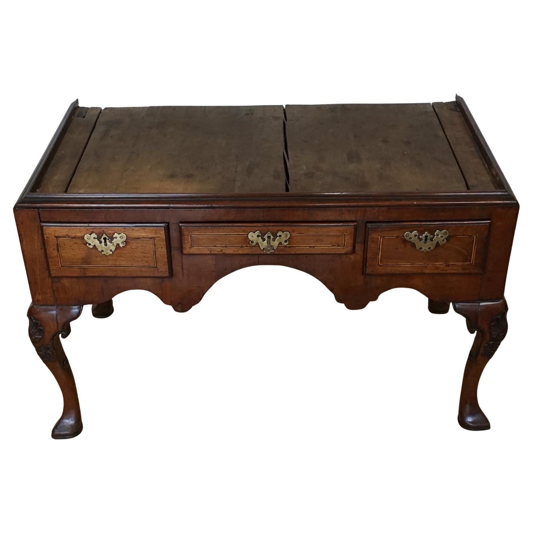 A George II Walnut Chest on Stand. Cabriole legs with shell motif. Original back plates with original brass furniture. Oak lined drawers. 


