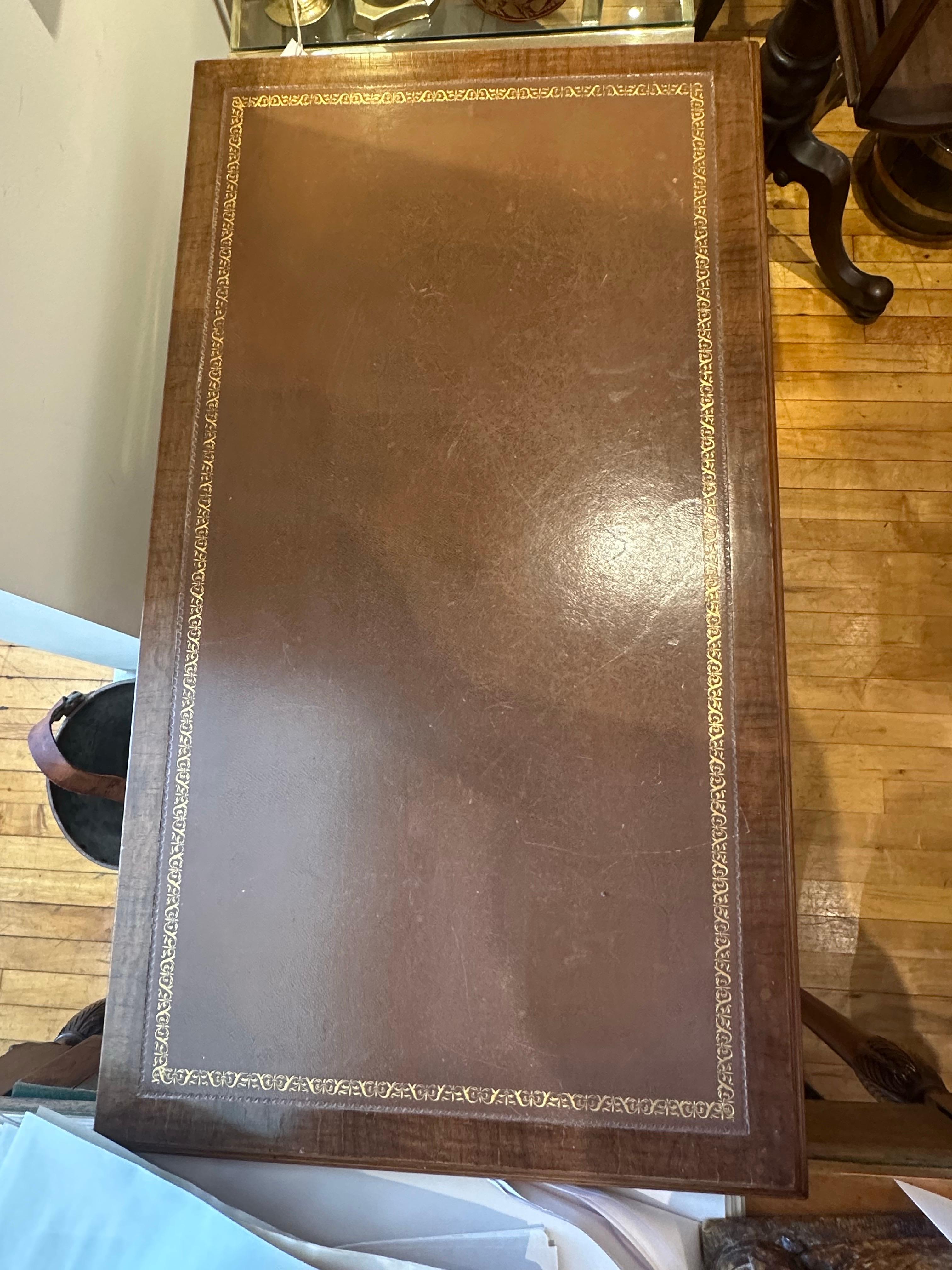 A George II walnut veneered writing desk with replaced leather top.  Great color and patination.