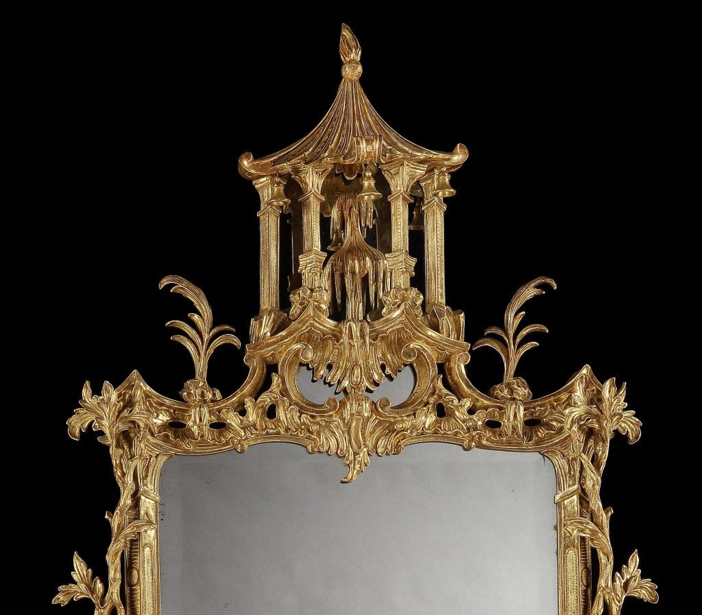 An exceptional George III Chippendale period giltwood mirror in the manner of Thomas Johnson. Of the finest quality throughout, the carving of the chinoiserie decoration is of outstanding detail. The cresting having a carved pagoda mounted with a