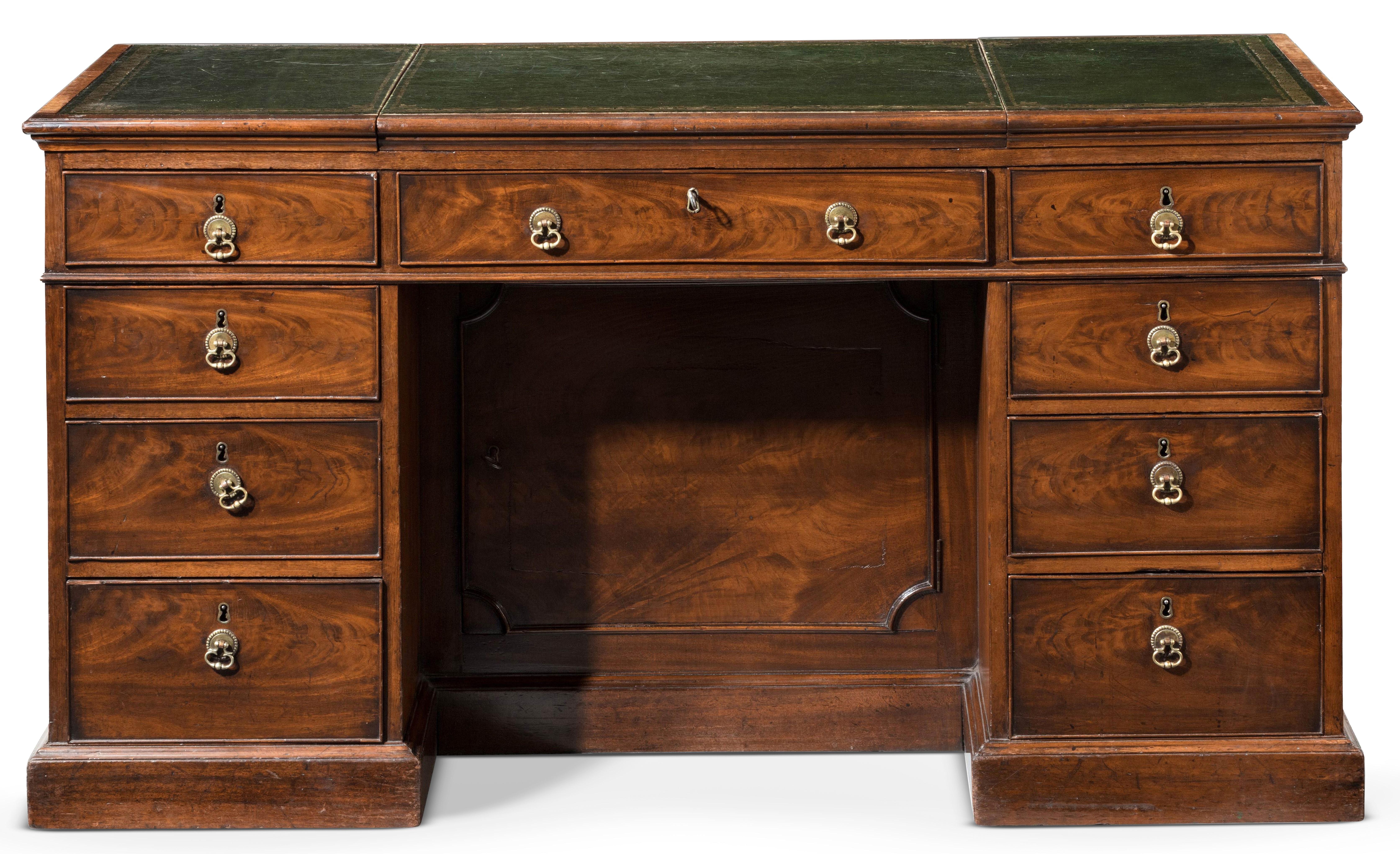 A Superbly made George III Chippendale Period Mahogany Writing Desk
The rectangular leather inset top with a cross-banded moulded edge,
and a lift up central panel, above three freeze drawers, support by three drawers on each side, with panelled
